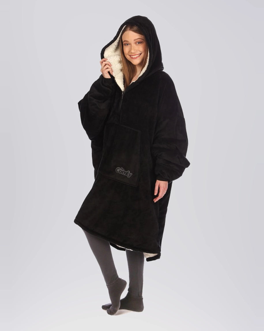 The Original Quarter-Zip wearable blanket in Black, front view with hood up.