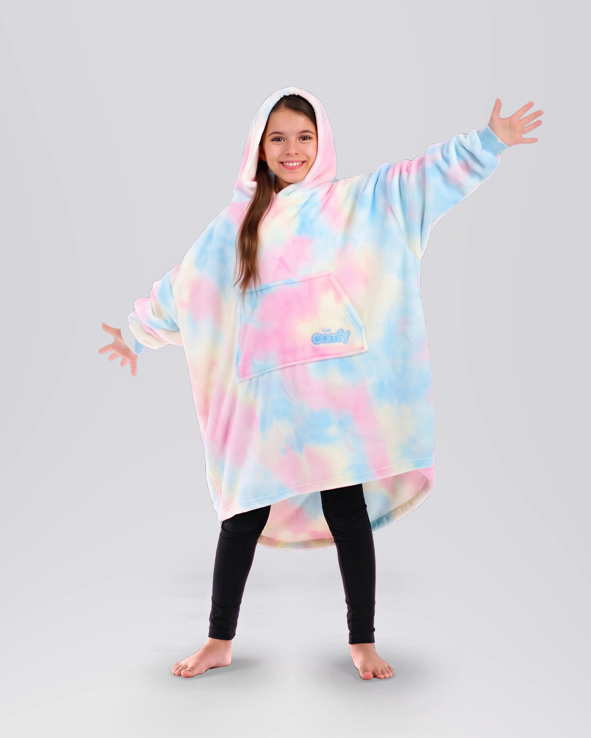 Child wearing The Dream Jr. in Cotton Candy Tie Dye, showing the kid-sized oversized silhouette and hood.