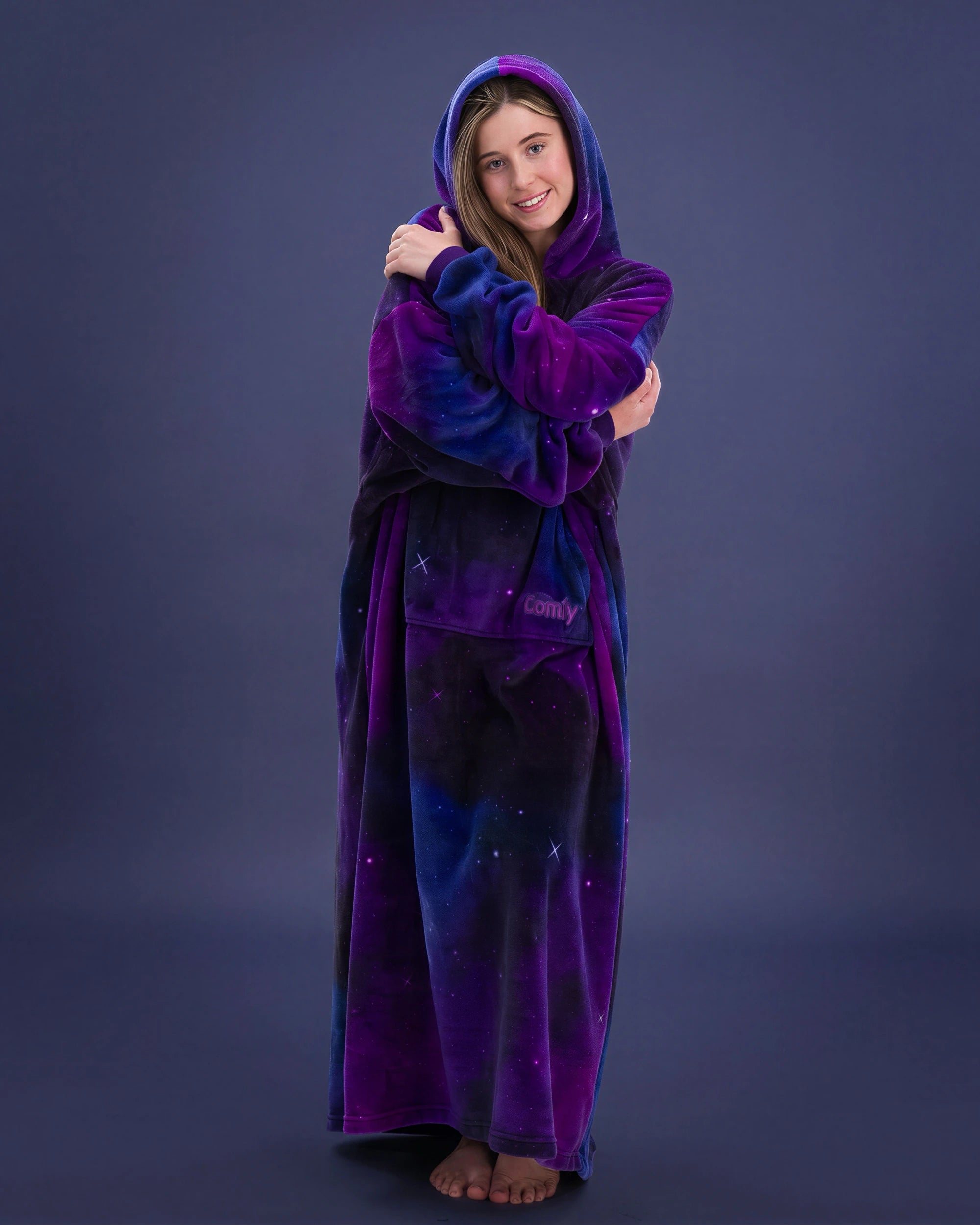 Woman wrapped in The Dream Long in Galaxy, showcasing the floor-length coverage and vibrant galaxy-inspired pattern.