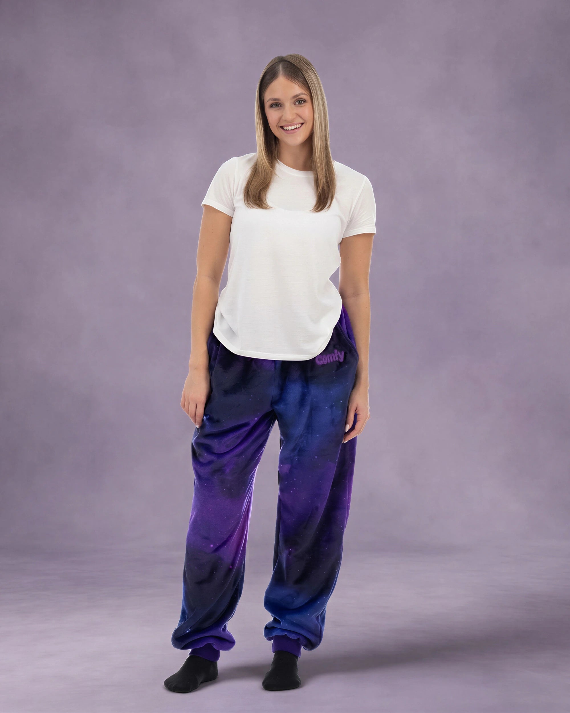 Woman wearing Dream Pants in Galaxy, showcasing the relaxed fit, soft Dream fabric, and all-over cosmic print.