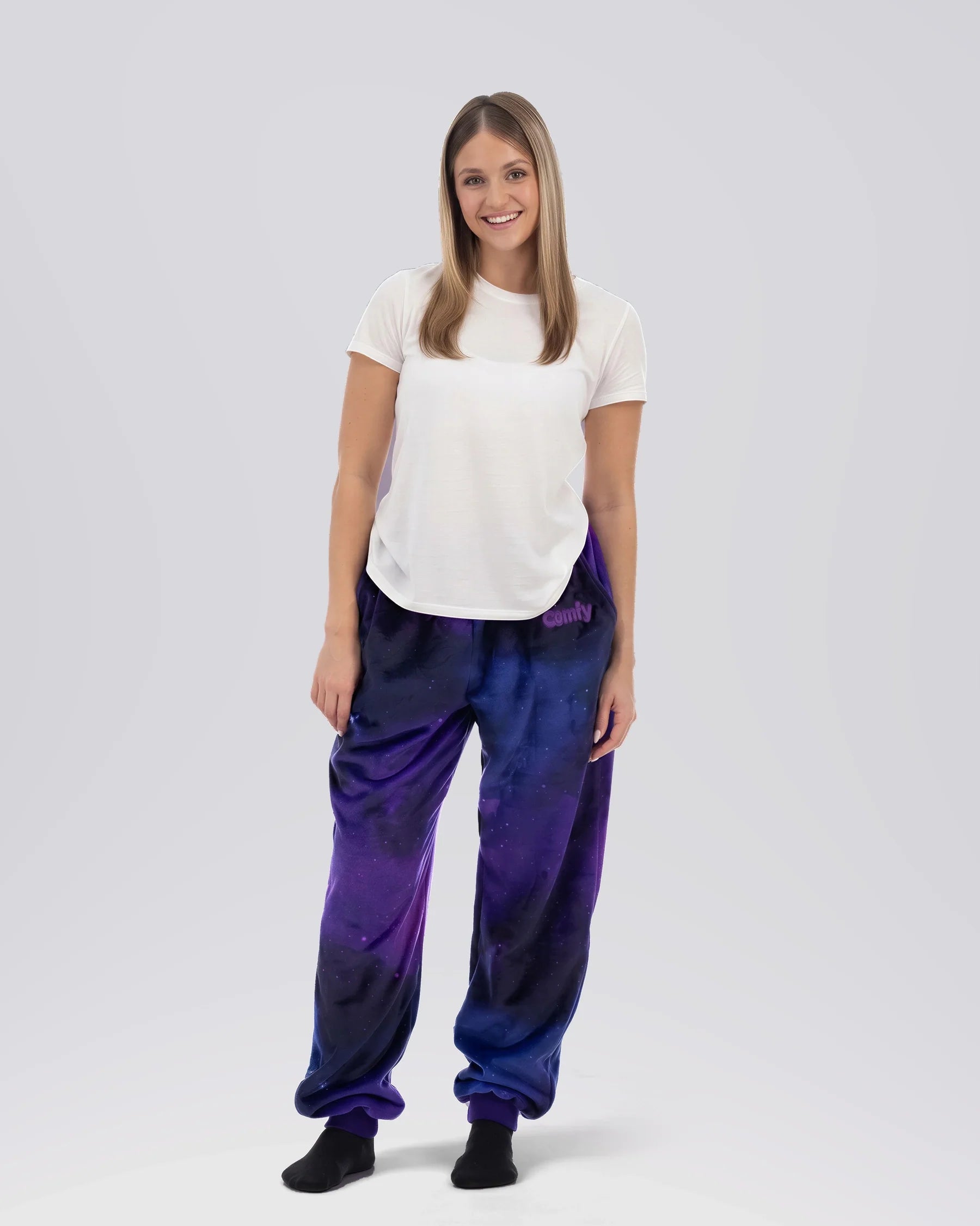 Woman wearing Dream Pants in Galaxy, showcasing the relaxed fit, soft Dream fabric, and all-over cosmic print.