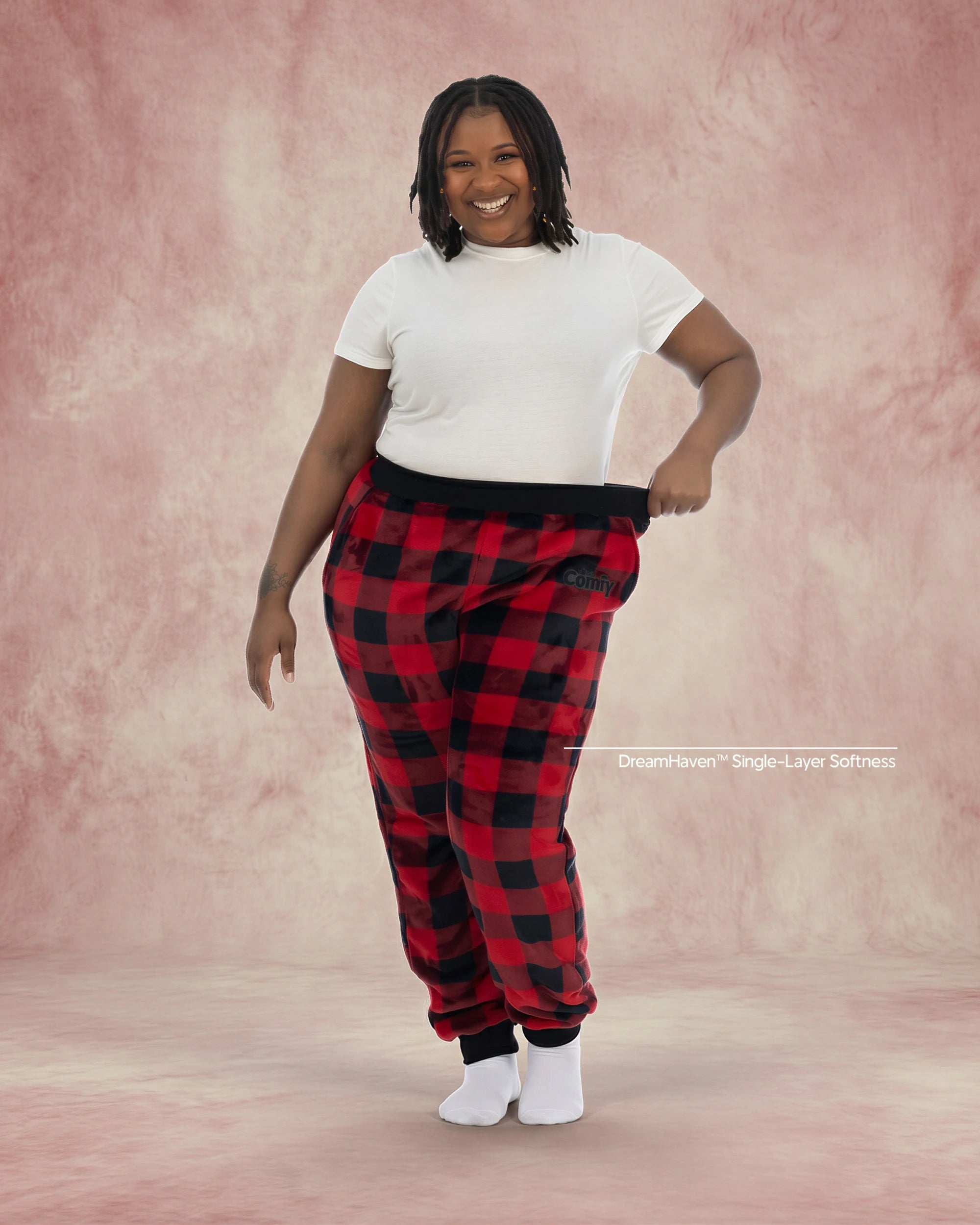 Woman wearing Dream Pants in Red Plaid, showcasing the relaxed fit, soft Dream fabric, and classic buffalo check pattern.