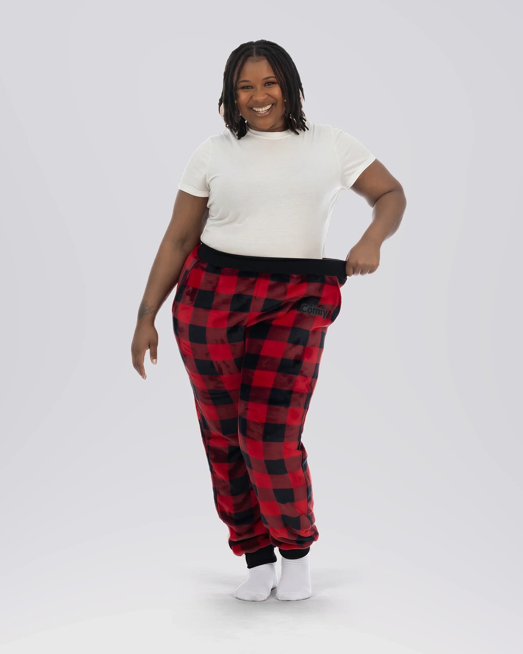 Woman wearing Dream Pants in Red Plaid, showcasing the relaxed fit, soft Dream fabric, and classic buffalo check pattern.