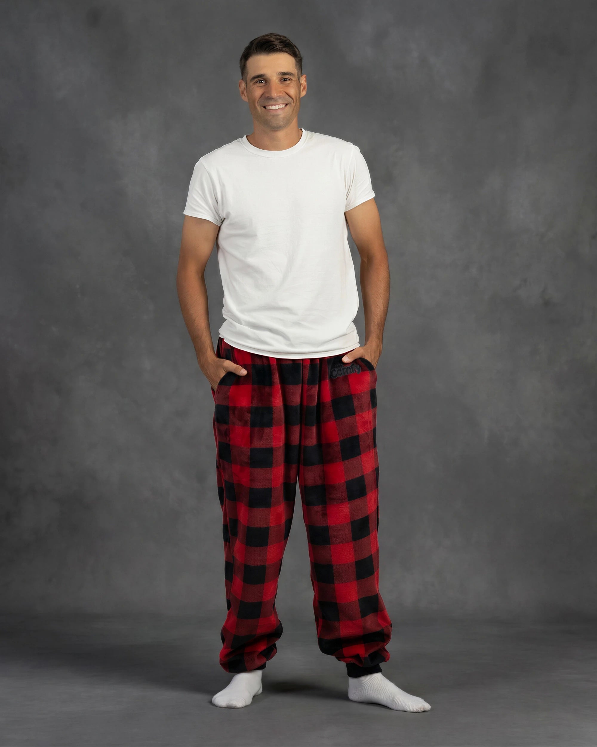 Man wearing Dream Pants in Red Plaid, showcasing the relaxed fit, side pockets, and classic buffalo check pattern.
