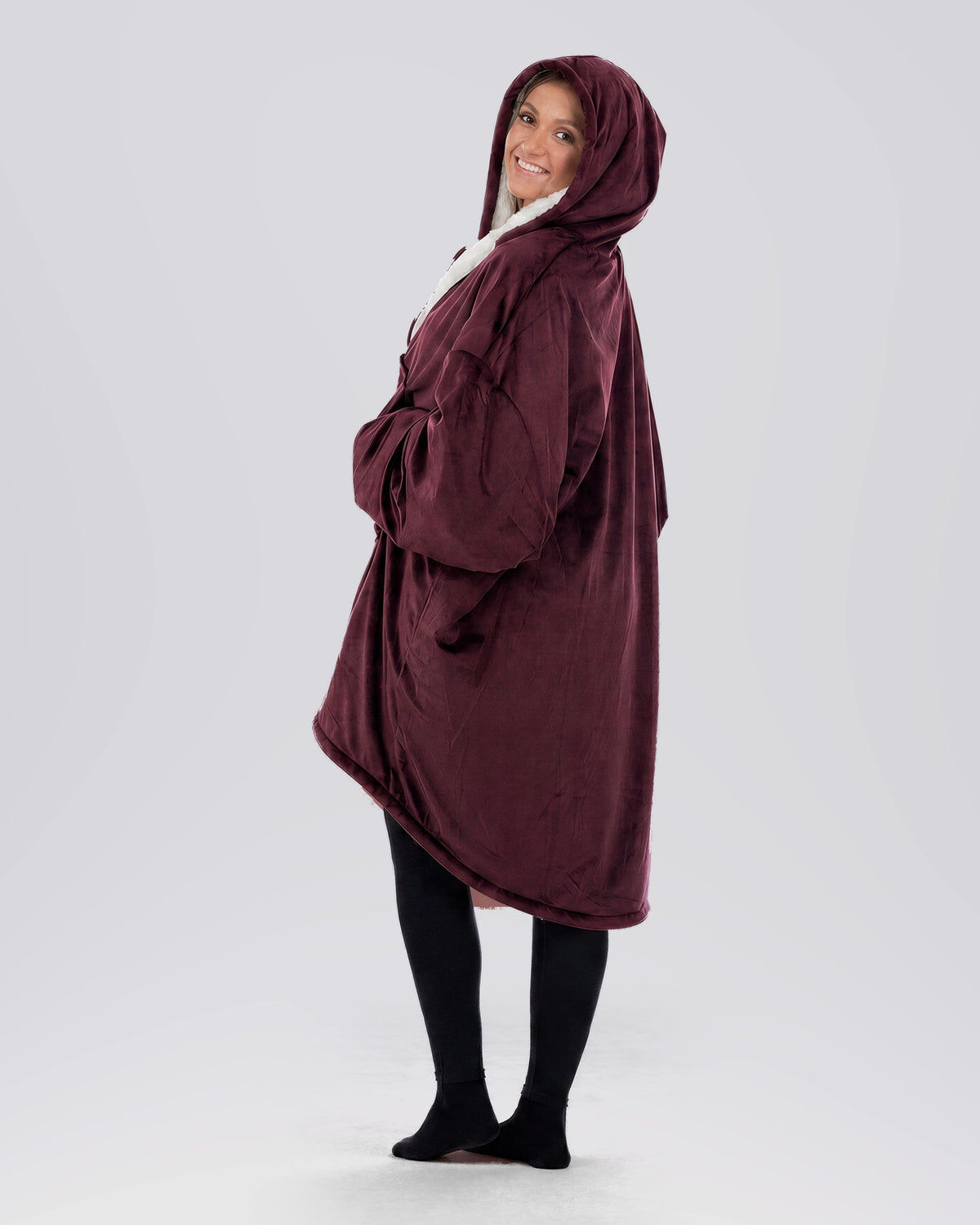 Side view of The Original Full-Zip wearable blanket in Burgundy highlighting hood, longer coverage, and relaxed silhouette.