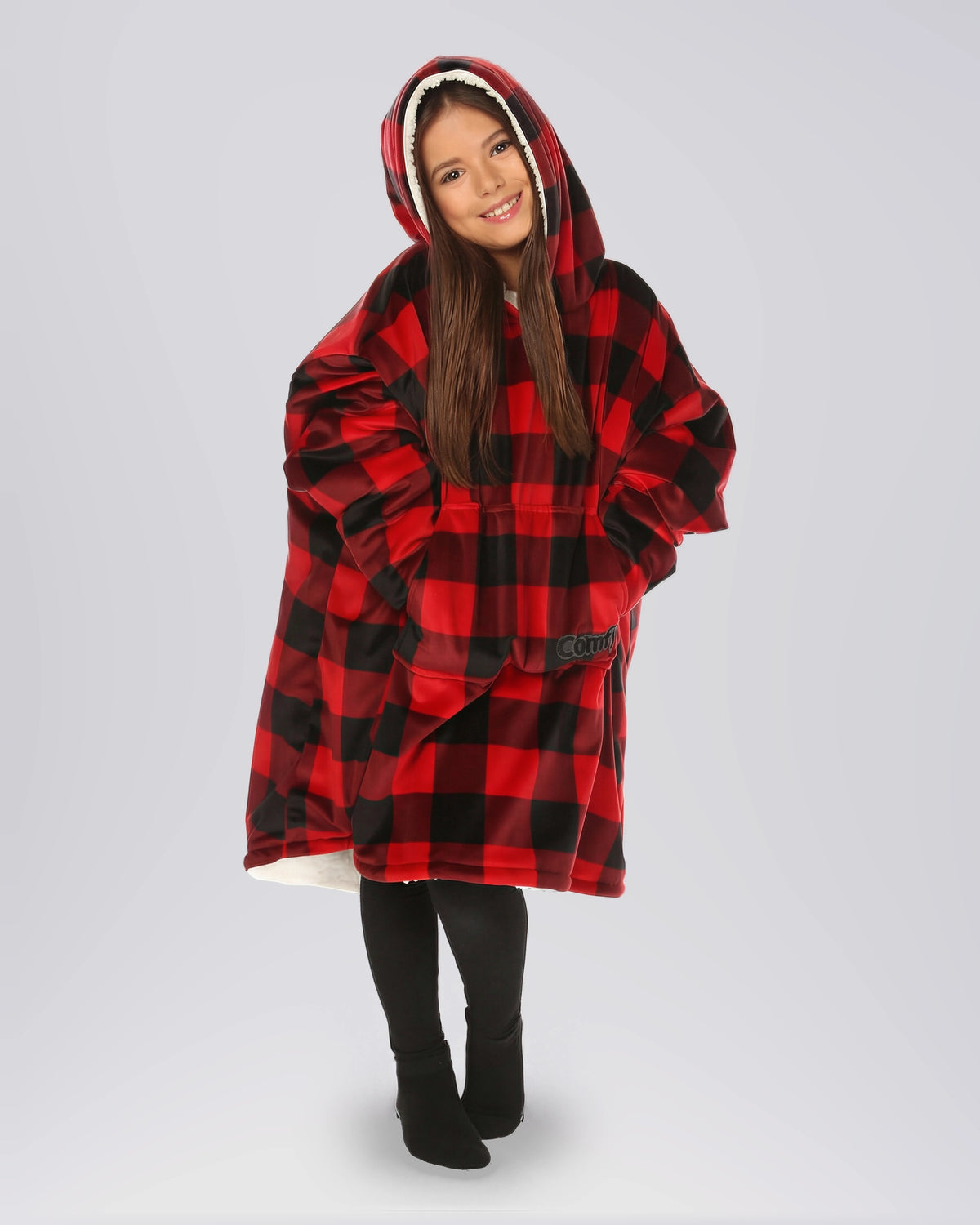 Child wearing The Original Jr. Red Plaid wearable blanket with CloudSherpa™ lining, featuring the classic buffalo plaid pattern, oversized hood, and cozy all-day comfort.