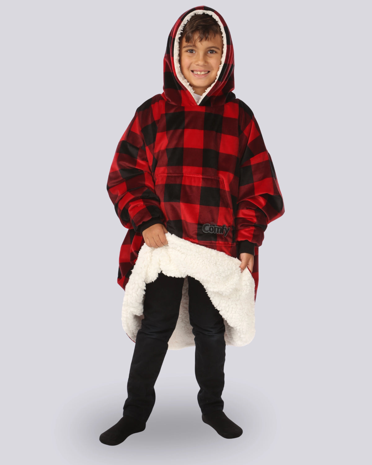 Child wearing The Original Jr. Red Plaid wearable blanket with showing the inside sherpa material.