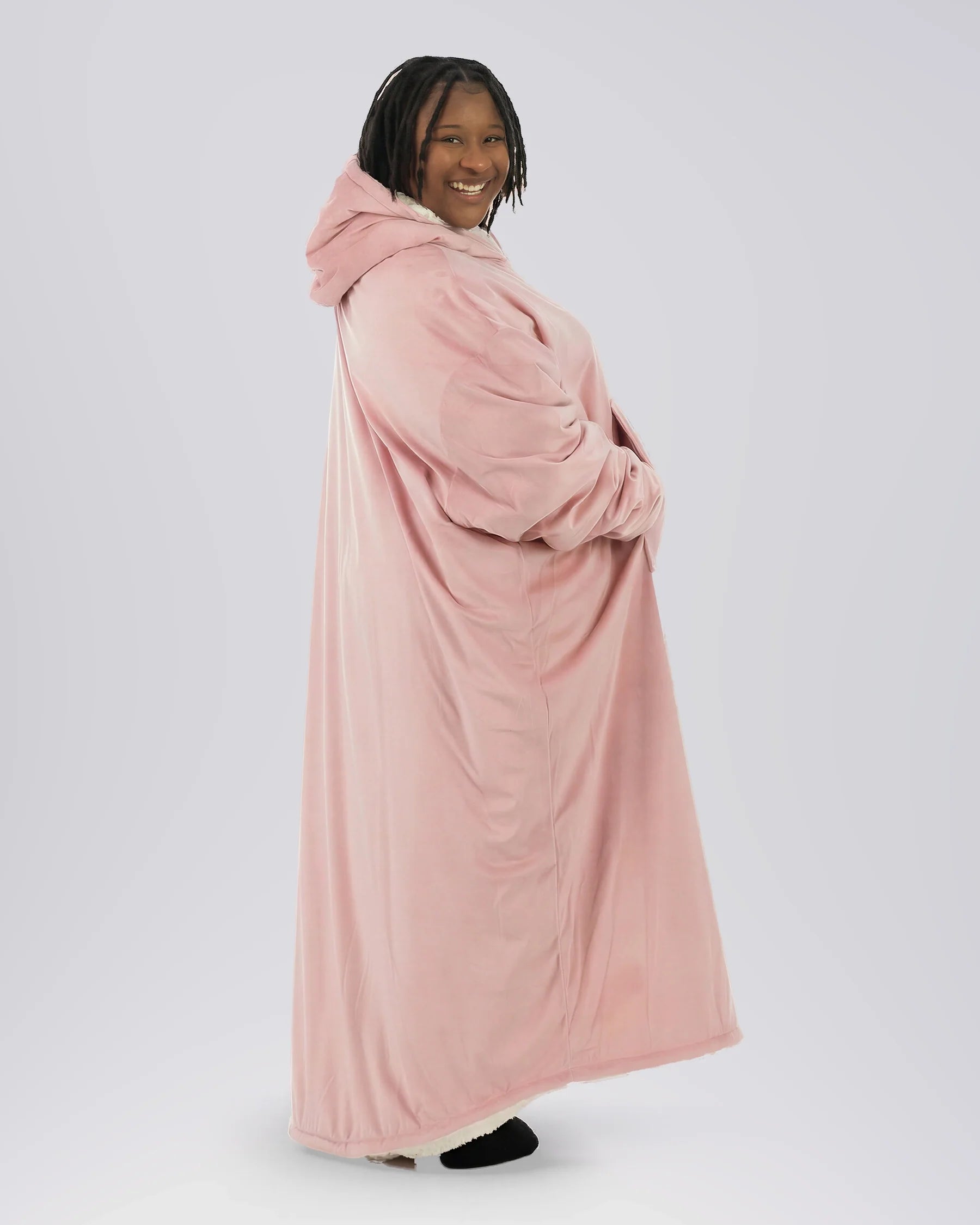 Side profile of woman wearing The Comfy Original Long in blush, showing full ankle-length silhouette and oversized drape.