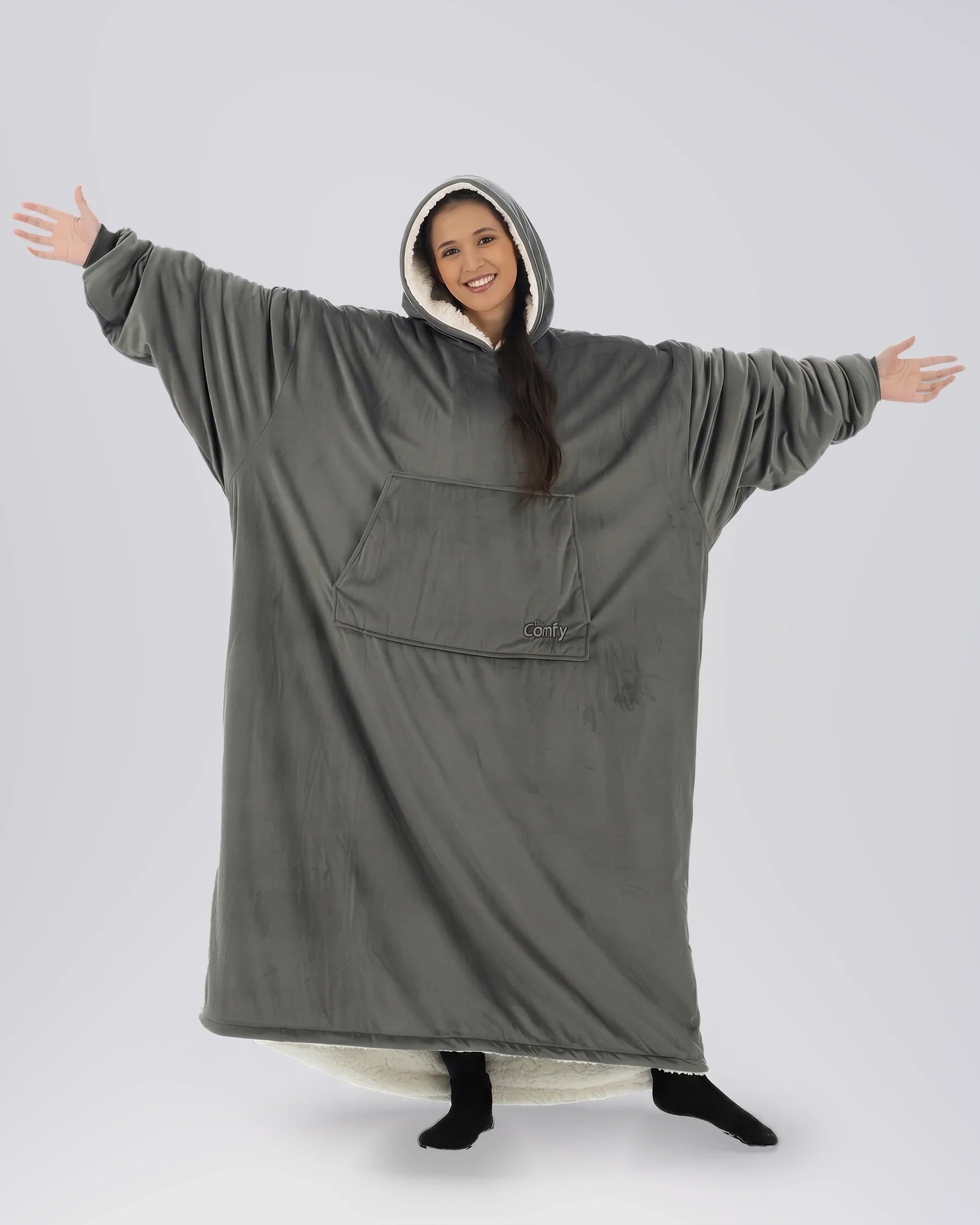 Woman wearing The Comfy Original Long in charcoal with CloudSherpa™ lining, front view showing oversized silhouette.
