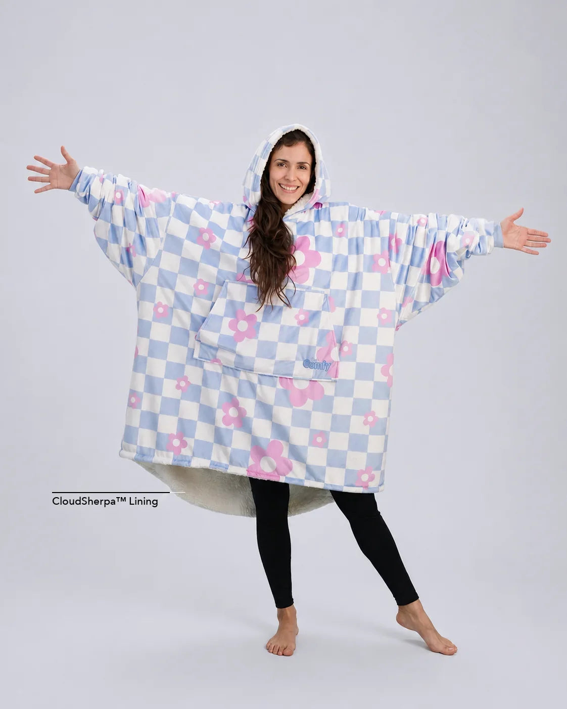 Front-facing hero image of The Original in Flower Checkered, featuring a playful blue-and-white checker pattern with pink floral accents, oversized silhouette, kangaroo pocket, and cozy CloudSherpa™ lining.