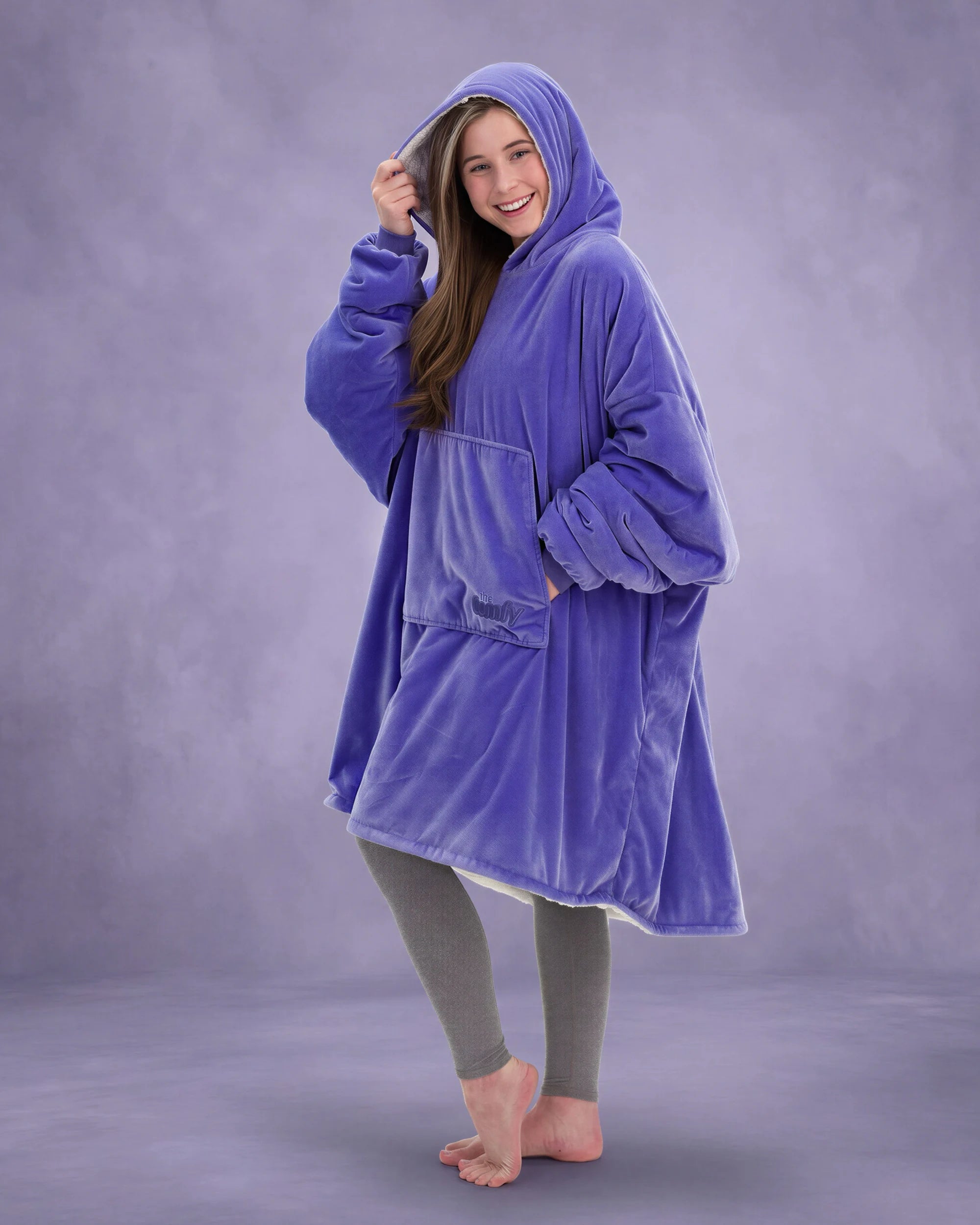 Side-angle view of The Original in Very Perri Purple, highlighting the relaxed oversized fit, roomy hood, and Velveluxe™ exterior designed for cozy comfort at home and beyond.