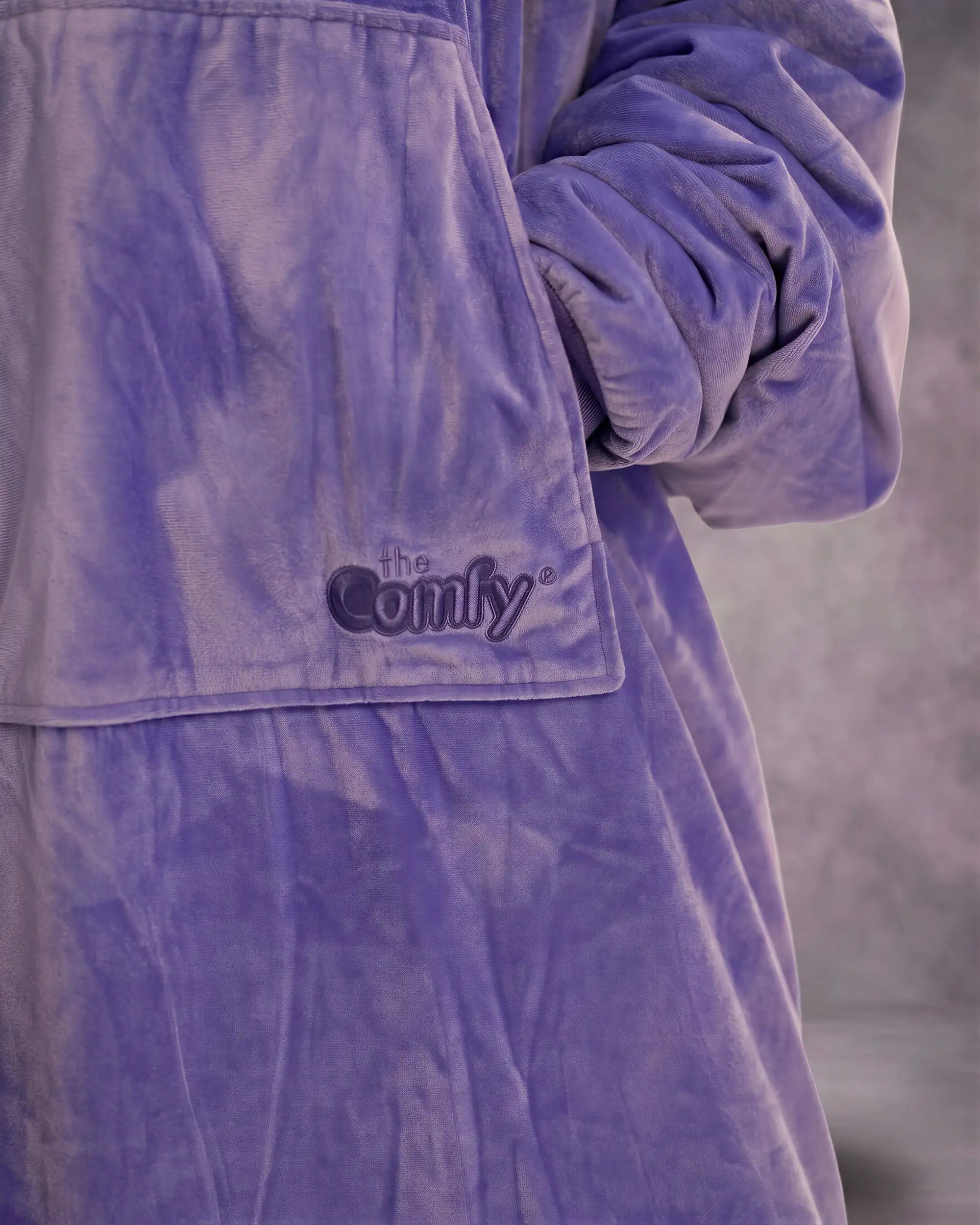 Close-up detail of The Original in Very Perri Purple featuring the ultra-soft Velveluxe™ exterior, oversized kangaroo pocket, embroidered logo, and premium construction details.