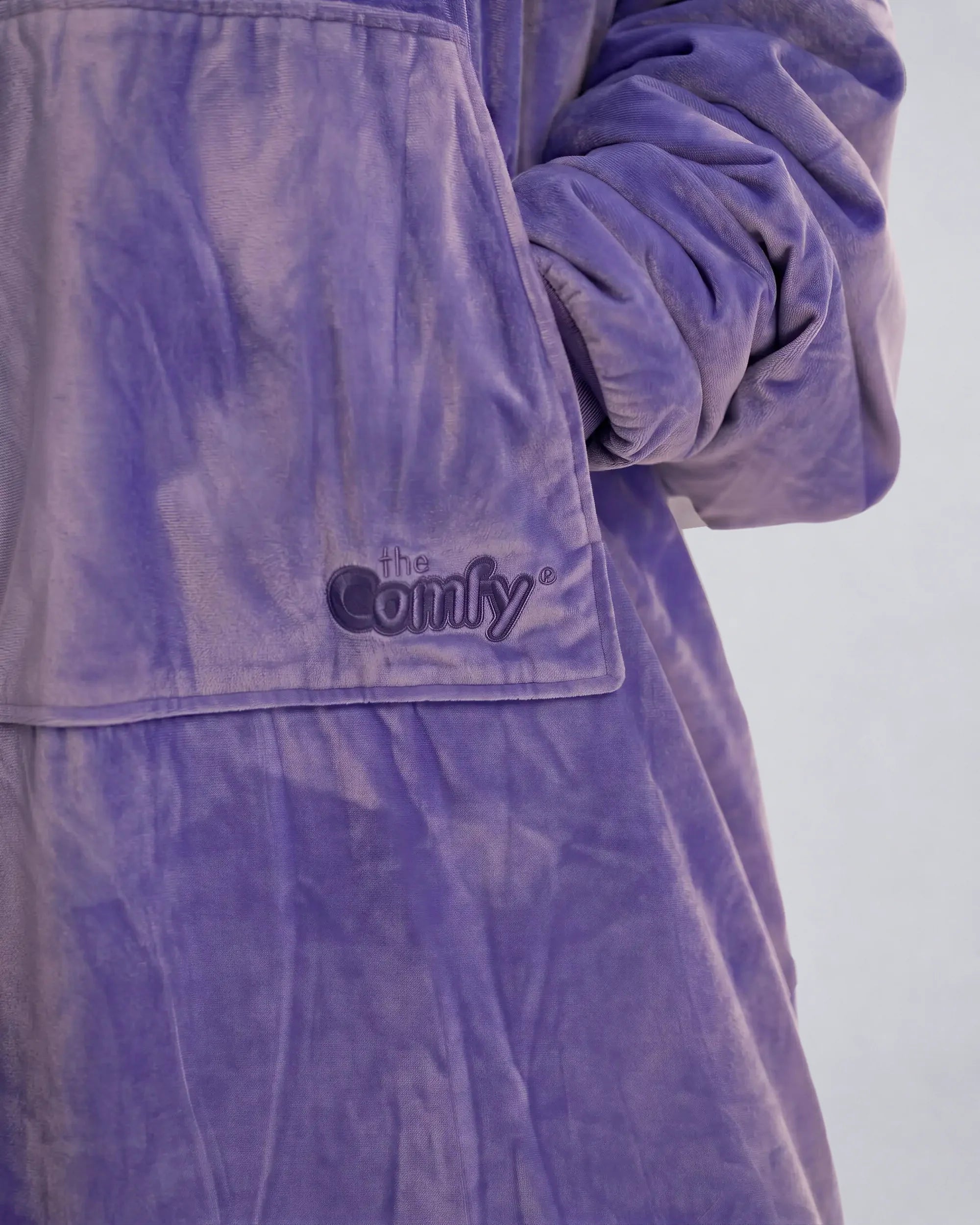 Close-up detail of The Original in Very Perri Purple featuring the ultra-soft Velveluxe™ exterior, oversized kangaroo pocket, embroidered logo, and premium construction details.