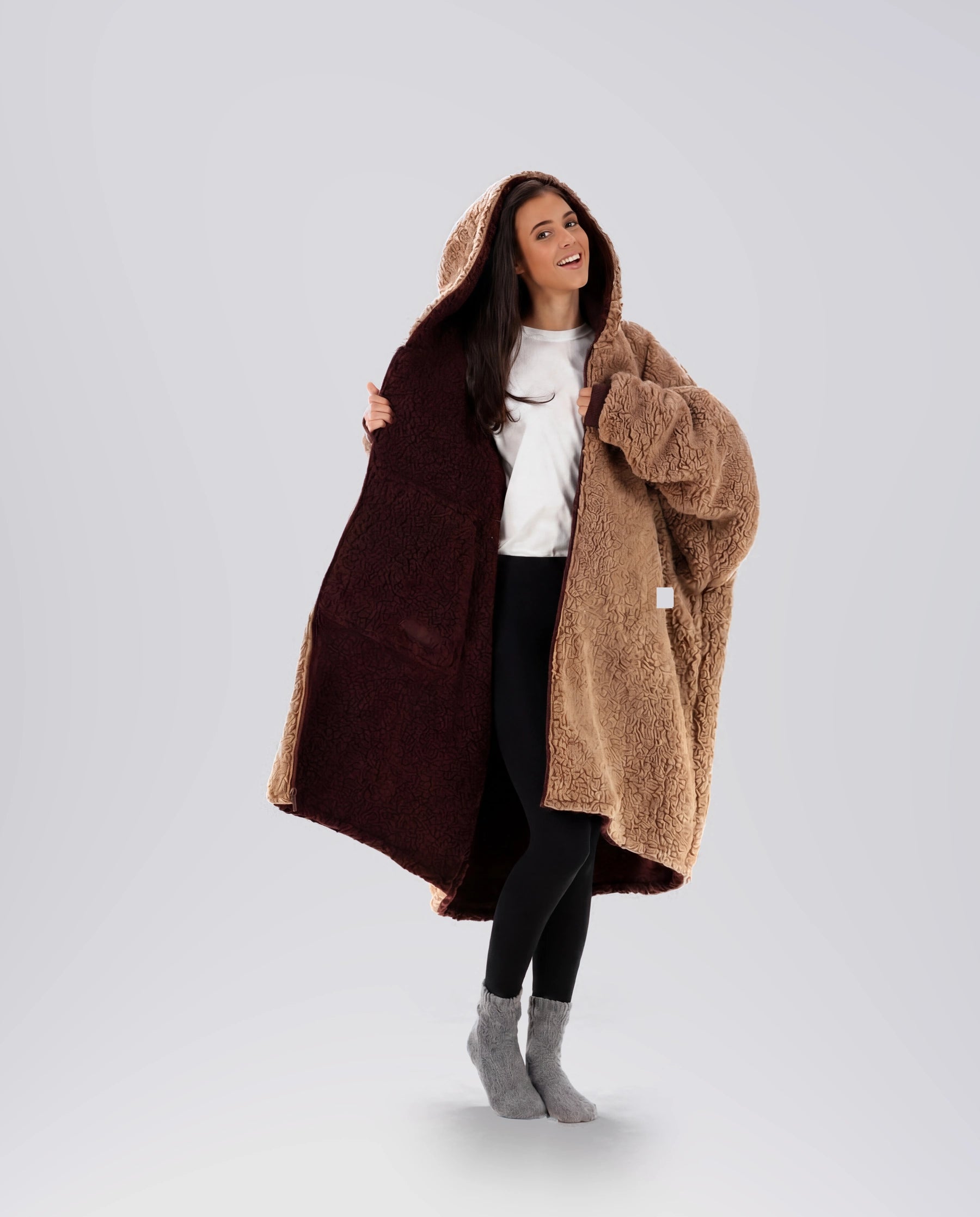 Woman modeling the Teddy Bear Full-Zip in Chocolate/Camel, showcasing the reversible double-layer CloudSherpa™ design and oversized comfort.