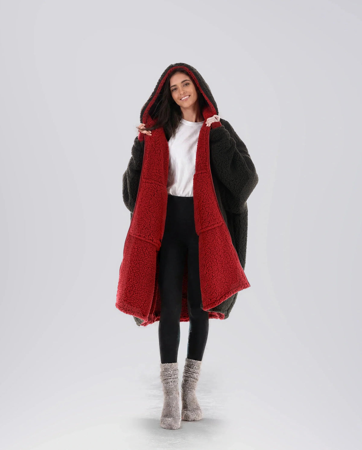 Woman modeling the Teddy Bear Full-Zip in Crimson/Black, showcasing the reversible double-layer CloudSherpa™ design and oversized fit.