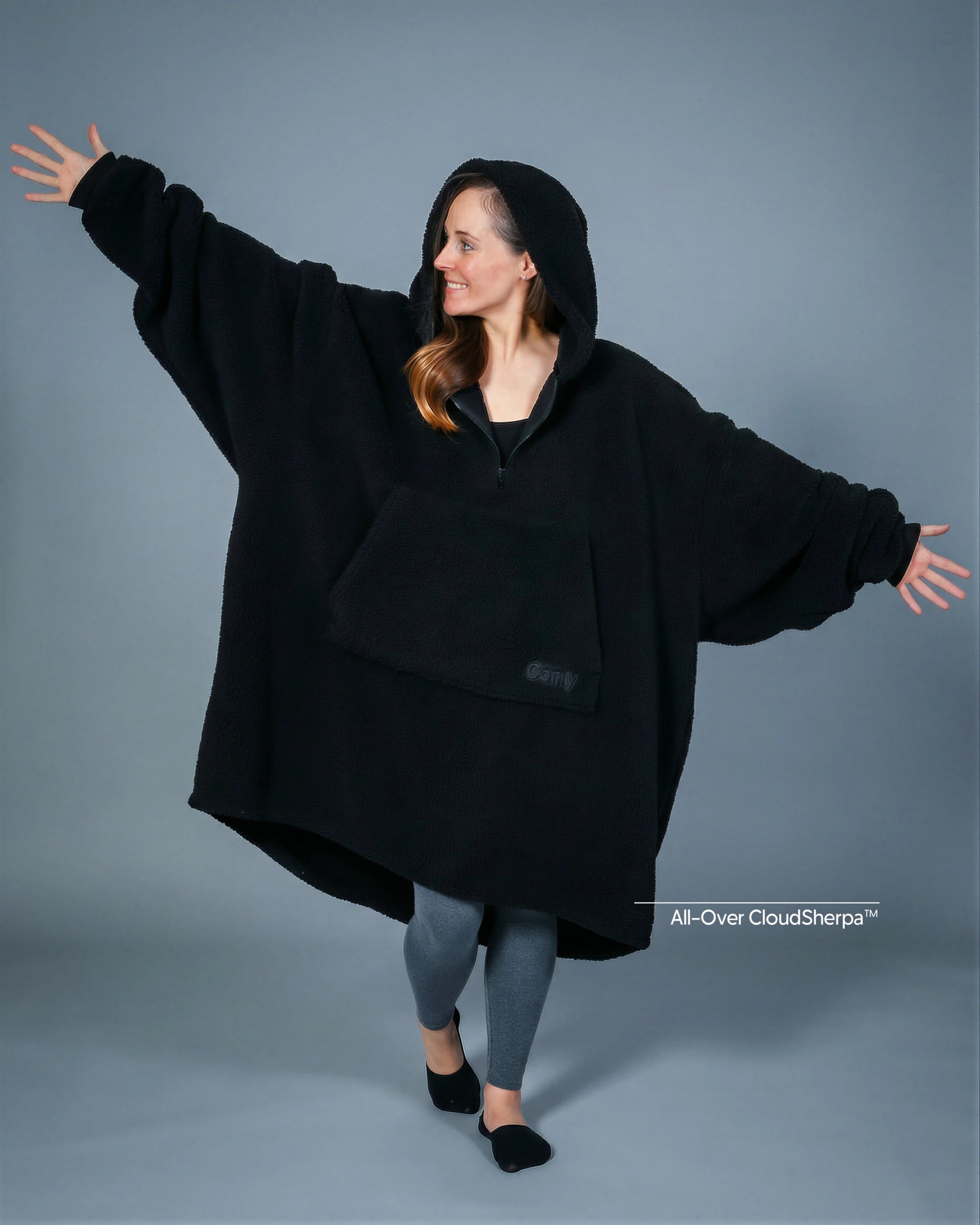 Front view of The Teddy Bear Quarter-Zip wearable blanket in black showing oversized fit and all-over CloudSherpa™ texture