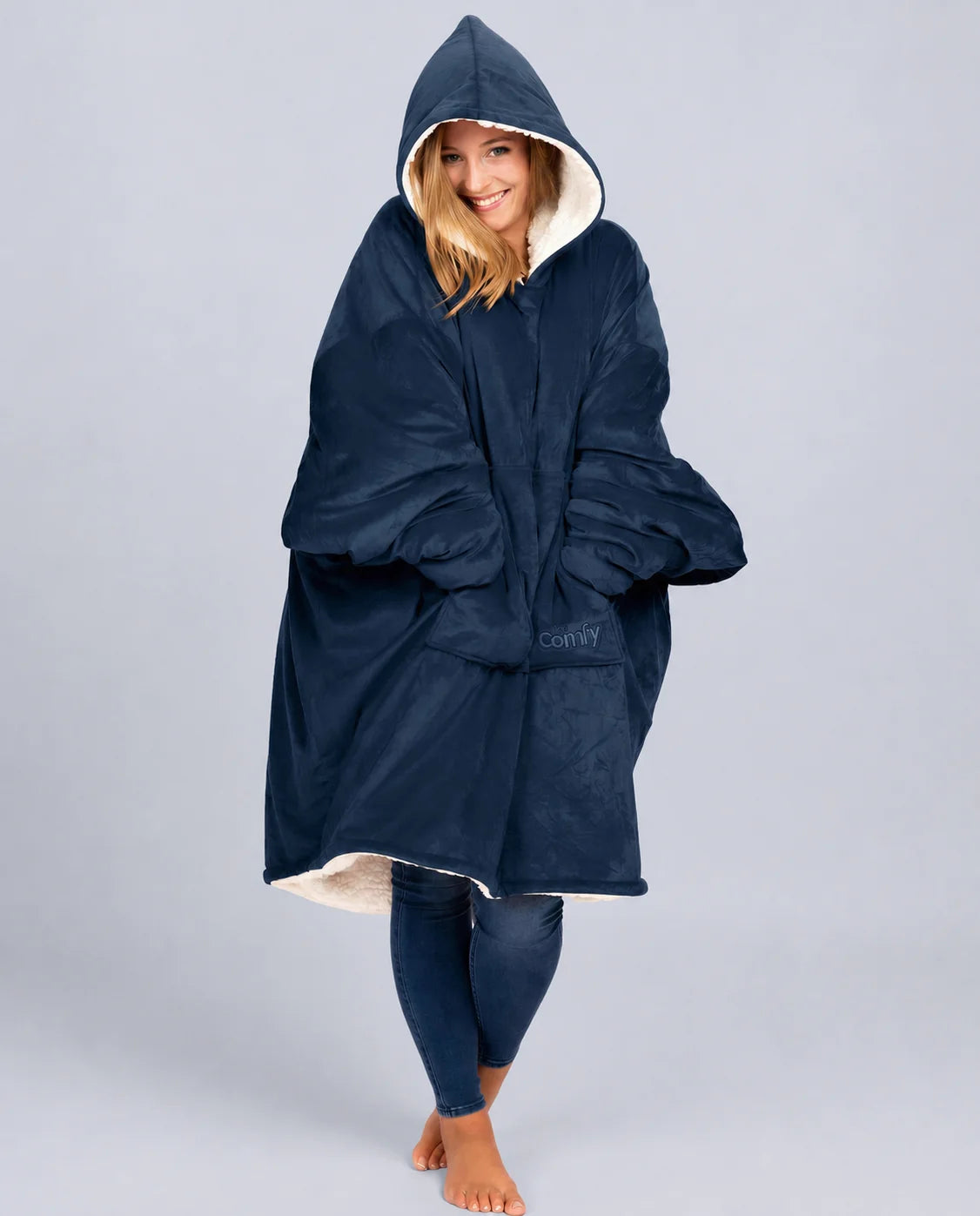 Front view of The Original wearable blanket in blue showing relaxed oversized fit and full coverage