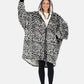 Woman waving wearing The Comfy Original Full Zip