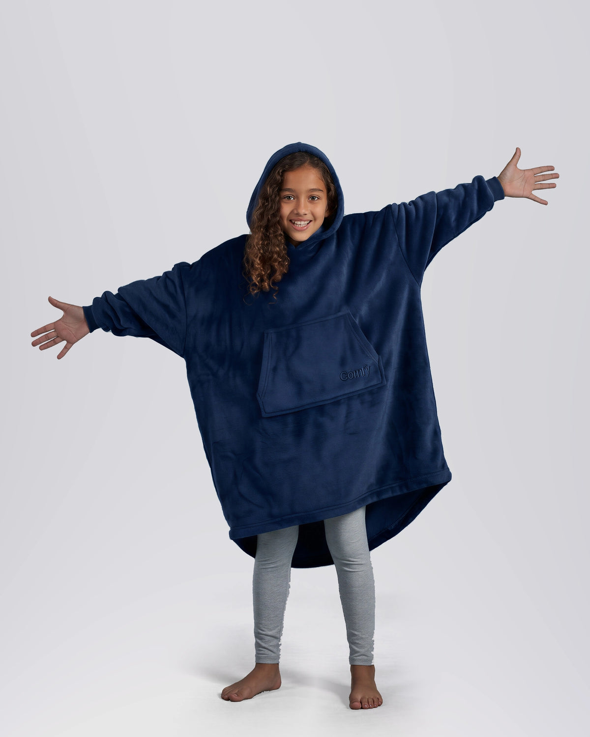 Child wearing The Dream Jr. in Sky Blue, showing the kid-sized oversized silhouette and hood.