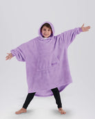 Child wearing The Dream Jr. in Heather Purple, showing the kid-sized oversized silhouette and hood.