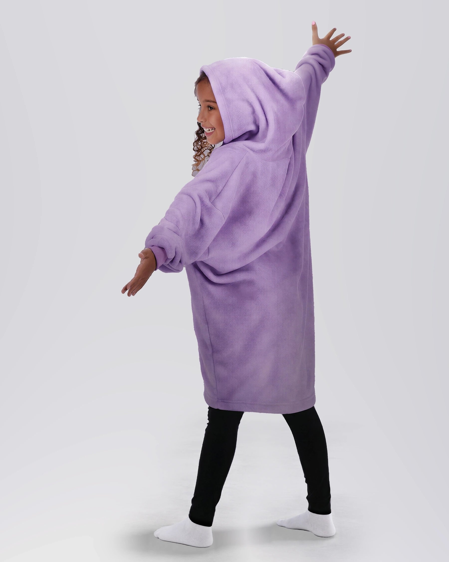 Back view of a child wearing The Dream Jr. in Heather Purple, showing the oversized hood and relaxed drape.