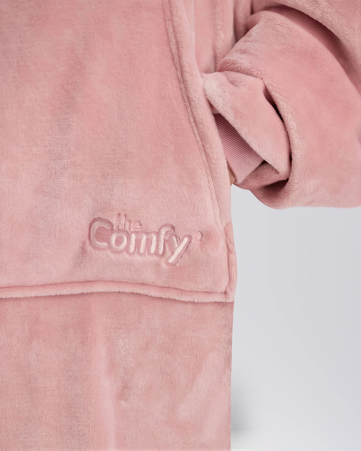 Close-up of The Dream Long in Blush showing its fabric and embroidered logo.