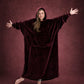 Woman with arms outstretched wearing The Dream Long in Burgundy, highlighting the oversized silhouette and full coverage.