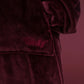Close-up of The Dream Long in Burgundy featuring the soft microfiber fabric, front pocket, and embroidered The Comfy logo.