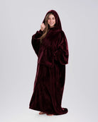 Front view of The Dream Long in Burgundy showing its floor-length coverage, oversized sleeves, and kangaroo pocket.