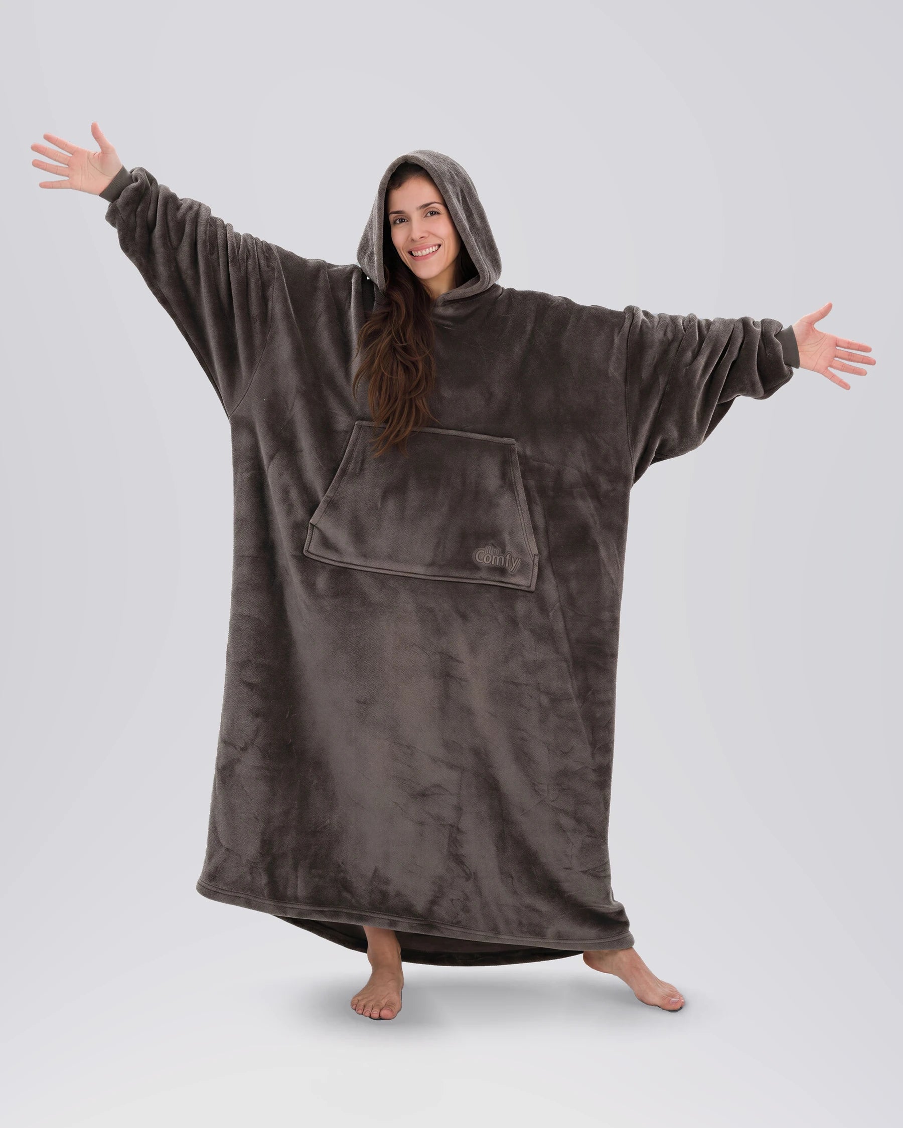 Woman standing with arms out in The Dream Long in Dark Gray, showing the full-length silhouette and relaxed drape.