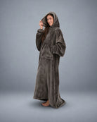 Side-profile view of a woman wearing The Dream Long with the hood up, highlighting the relaxed drape, oversized fit, and cozy kangaroo pocket.