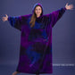 Woman with arms outstretched wearing The Dream Long in Galaxy, showcasing the floor-length design and all-over cosmic print.