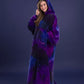 Woman wearing The Dream Long in Galaxy with hood up, highlighting the oversized fit and celestial-inspired purple and blue design.