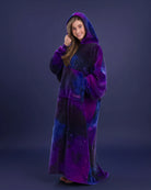 Woman wearing The Dream Long in Galaxy with hood up, highlighting the oversized fit and celestial-inspired purple and blue design.