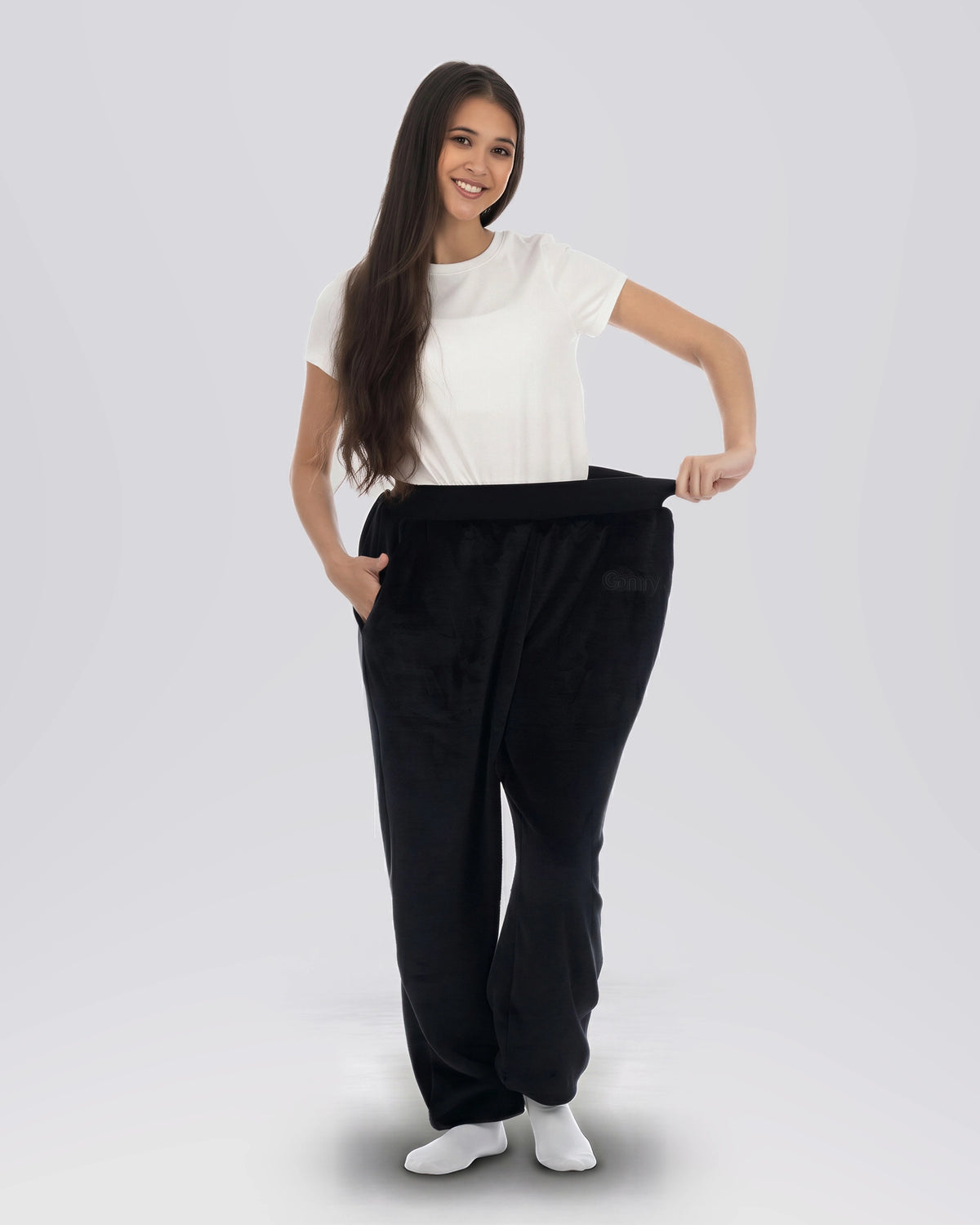 Model wearing The Dream Pants in Black, front view highlighting the waistband.
