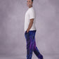 Man wearing Dream Pants in Galaxy in side profile, showcasing the relaxed silhouette, cuffed ankles, and galaxy print design.