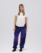 Woman wearing Dream Pants in Galaxy, showcasing the relaxed fit, soft Dream fabric, and all-over cosmic print.