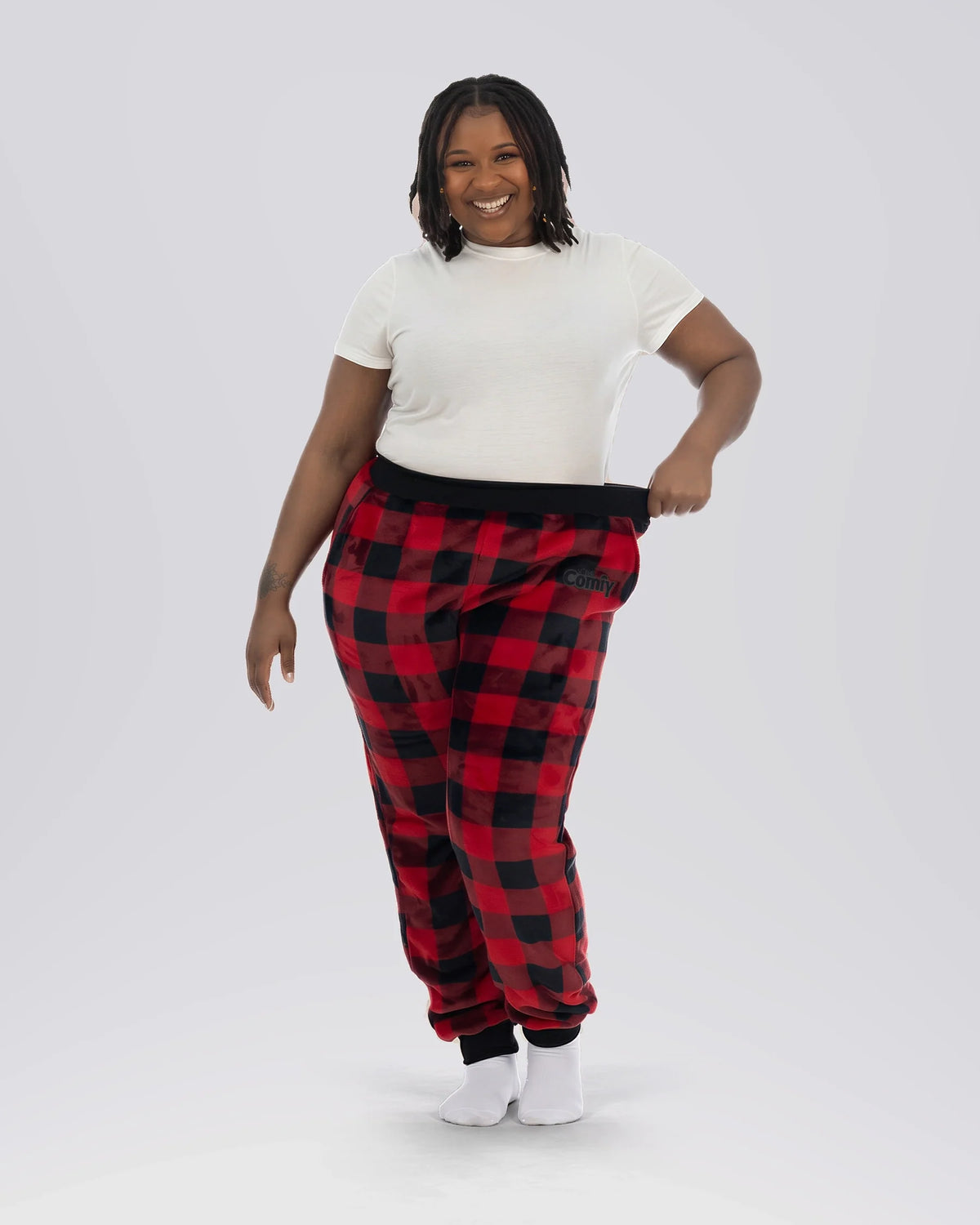 Woman wearing Dream Pants in Red Plaid, showcasing the relaxed fit, soft Dream fabric, and classic buffalo check pattern.