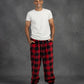 Man wearing Dream Pants in Red Plaid, showcasing the relaxed fit, side pockets, and classic buffalo check pattern.