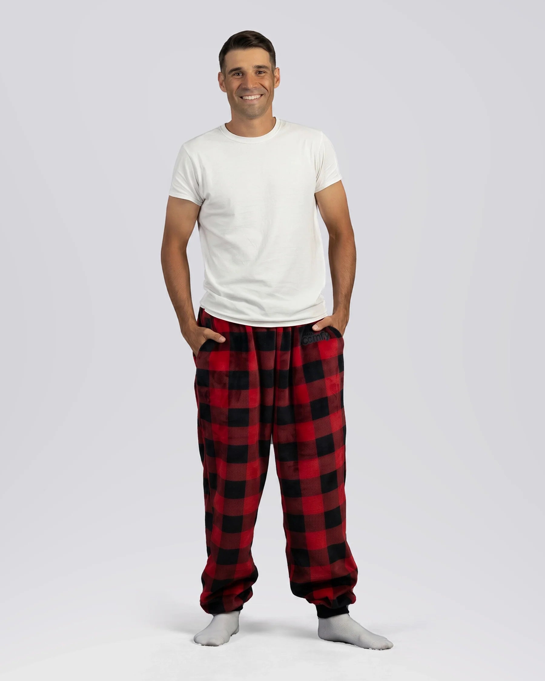 Man wearing Dream Pants in Red Plaid, showcasing the relaxed fit, side pockets, and classic buffalo check pattern.