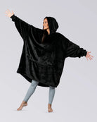 Model wearing The Dream in Black, showing its oversized silhouette, hood, and DreamHaven™ single-layer softness.