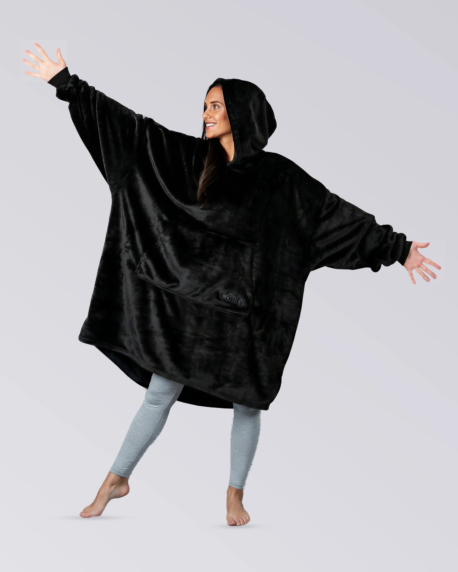 Model wearing The Dream in Black, showing its oversized silhouette, hood, and DreamHaven™ single-layer softness.