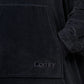 Detailed view of The Dream wearable blanket’s kangaroo pocket and premium microfiber construction, showcasing the soft texture and clean design details.