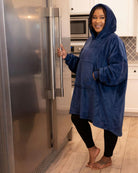 lifestyle image of a woman in the kitchen wearing the dream in blue.