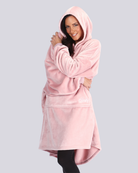 Model wearing The Dream in Blush, hugging herself looking cozy.