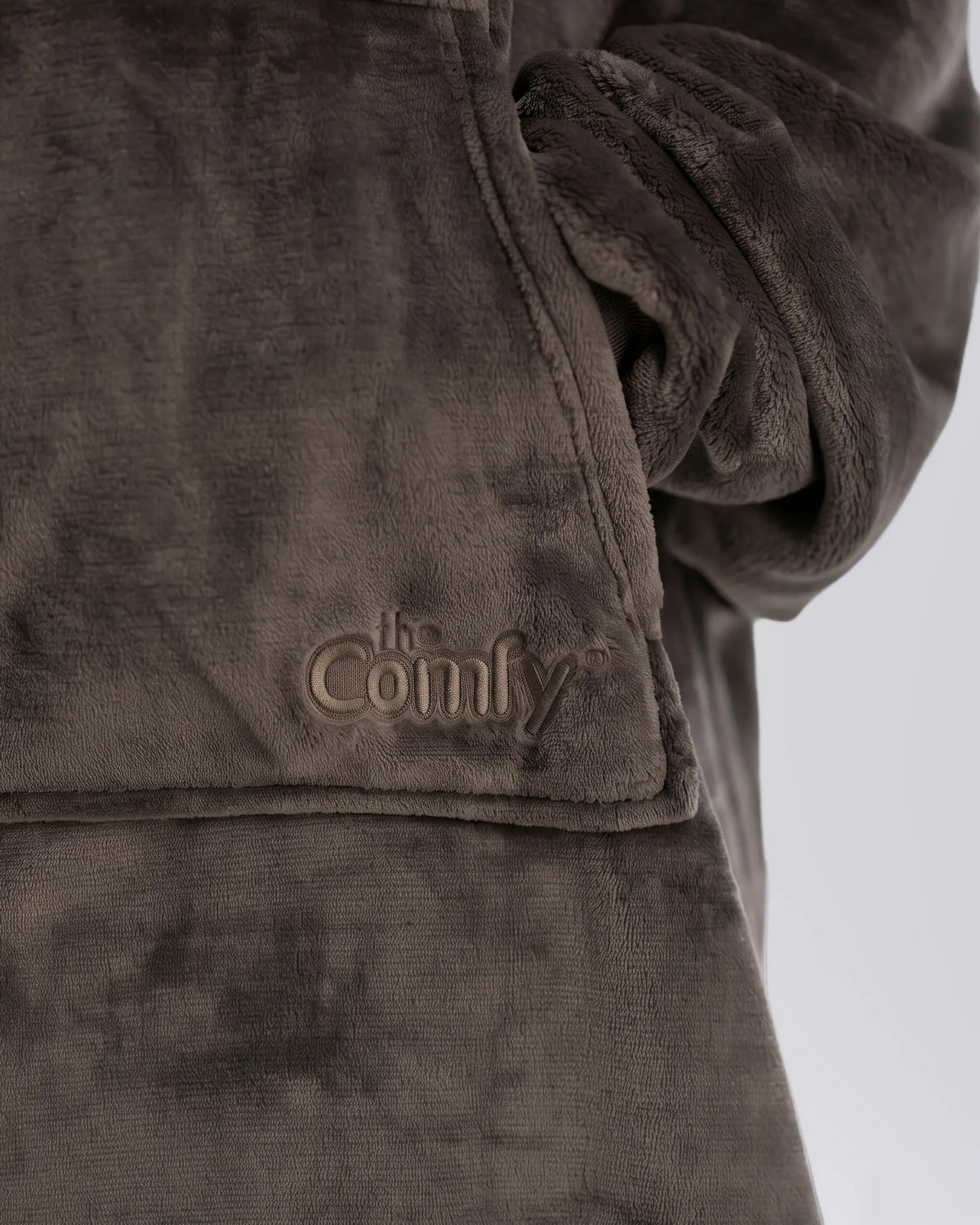 Close-up of The Dream in Dark Gray showing its fabric and embroidered logo.