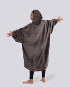 Back view of a model wearing The Dream in Dark Gray. The model's arms are stretched out.