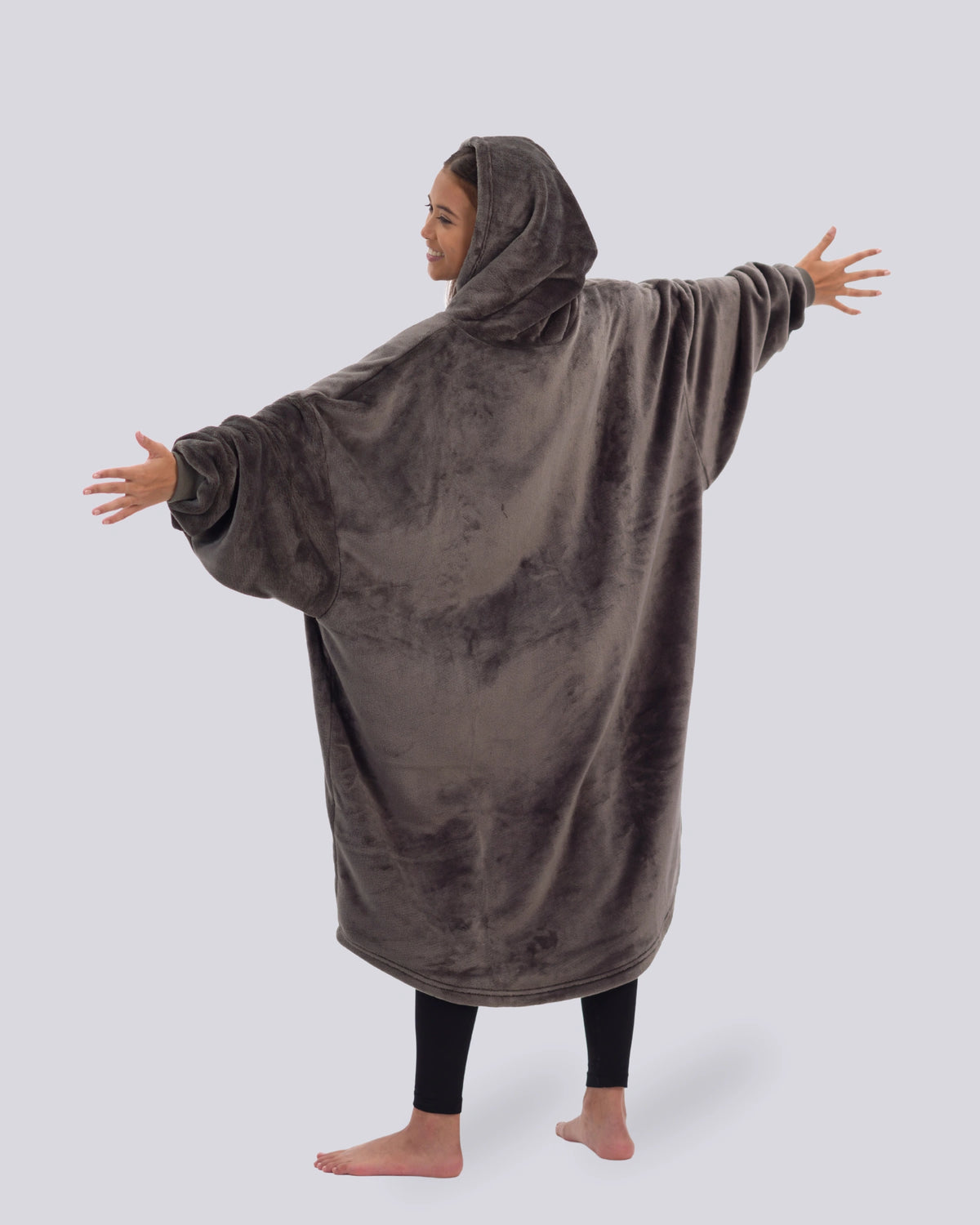 Back view of a model wearing The Dream in Dark Gray. The model's arms are stretched out.
