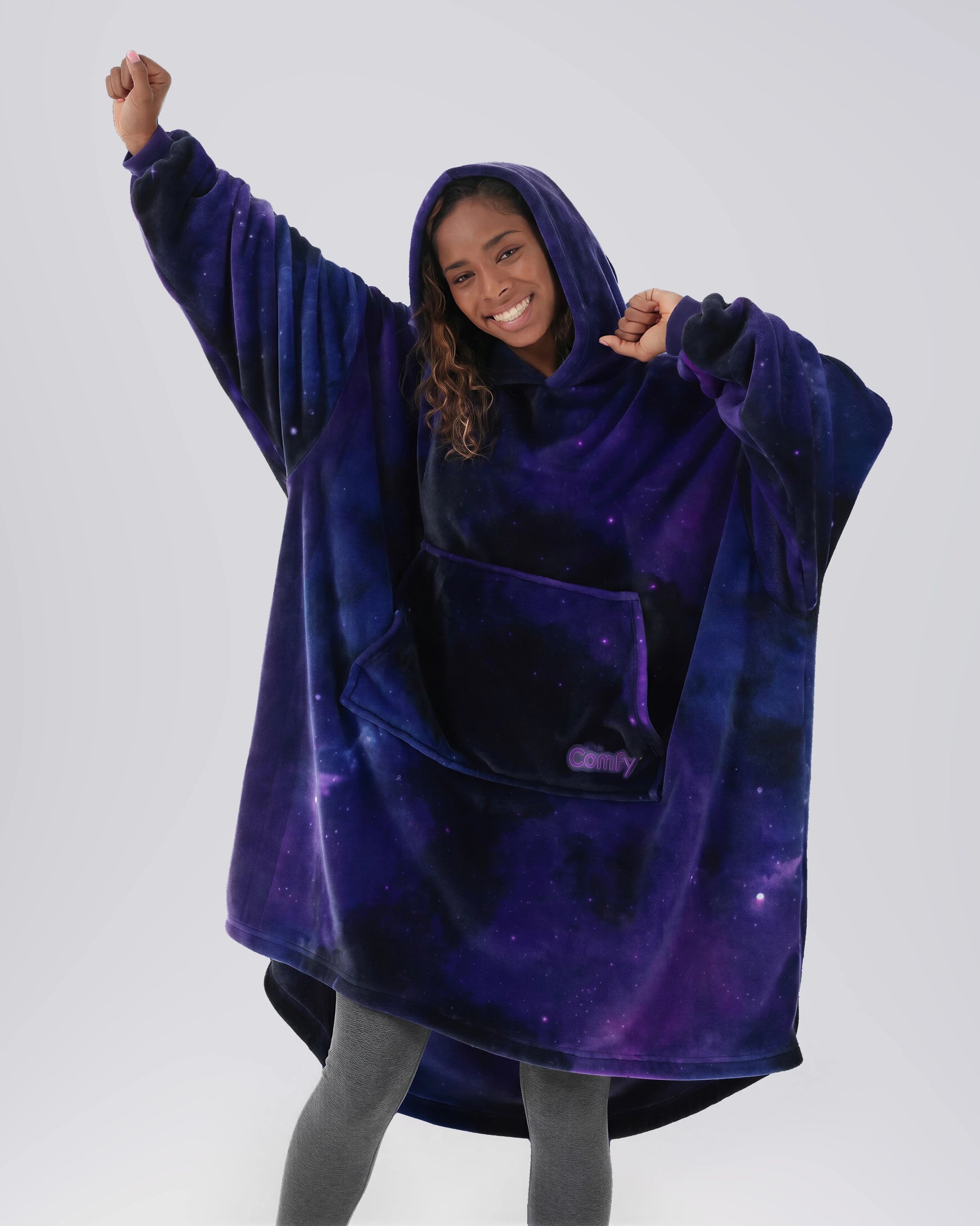 Model wearing The Dream in Galaxy with the hood up, showing its relaxed oversized shape.