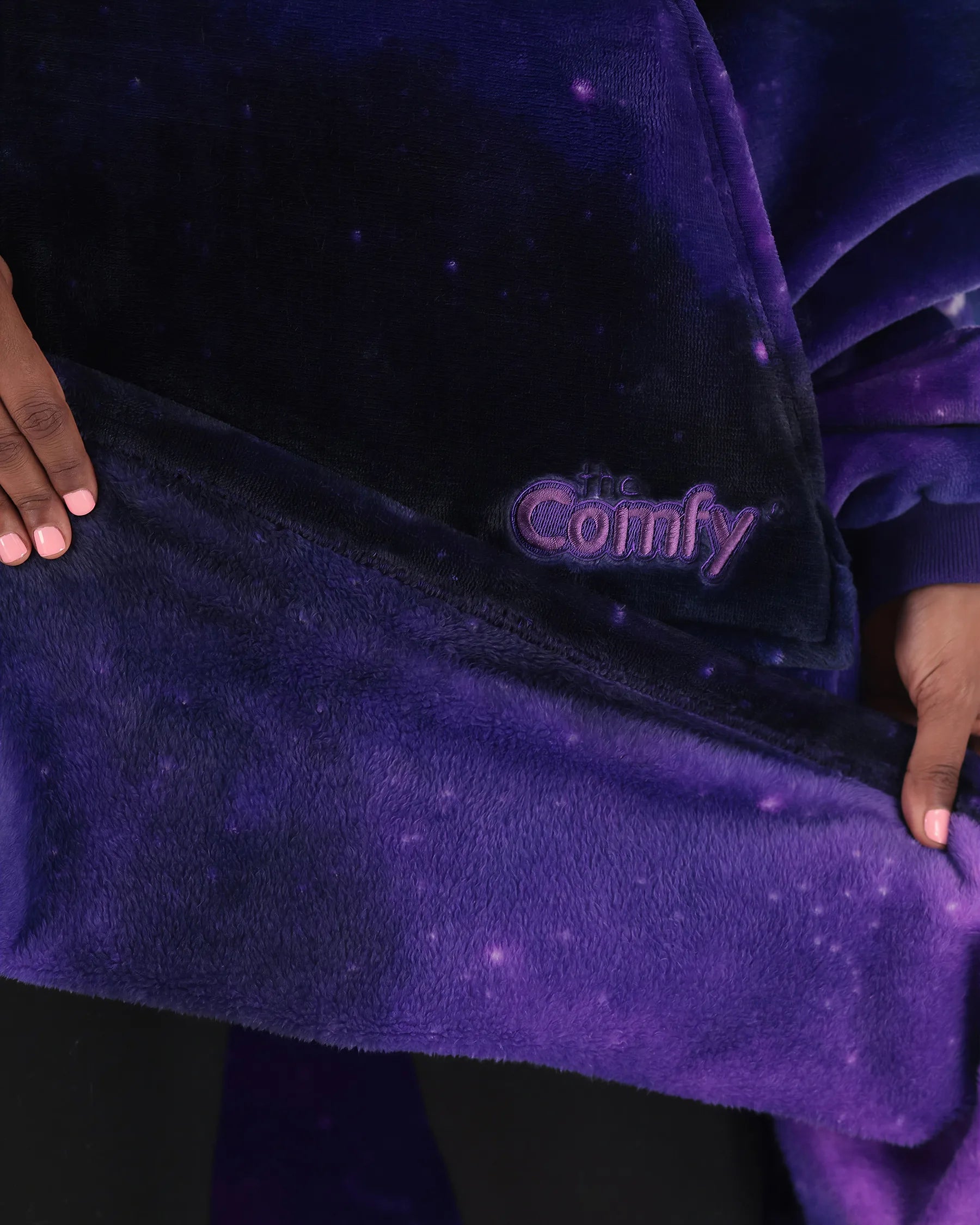 Close-up of The Dream in Galaxy showing DreamHaven™ fabric, the kangaroo pocket, and Comfy embroidery.